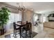 Inviting dining area featuring modern lighting and backyard views at 3313 Jamaica Princess Pl # 3, North Las Vegas, NV 89084