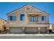 Inviting two-story home featuring a three-car garage and charming balcony at 3313 Jamaica Princess Pl # 3, North Las Vegas, NV 89084