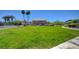 Expansive community green space with vibrant grass, bordered by lush landscaping and trees at 3313 Jamaica Princess Pl # 3, North Las Vegas, NV 89084