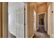 Hallway with tan walls, white doors and trim, and tan carpet flooring at 3313 Jamaica Princess Pl # 3, North Las Vegas, NV 89084