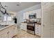 Updated kitchen showcasing stainless steel appliances and classic subway tile backsplash at 3313 Jamaica Princess Pl # 3, North Las Vegas, NV 89084