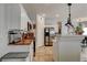 Well-lit kitchen featuring stainless steel appliances, light cabinets and tiled floors at 3313 Jamaica Princess Pl # 3, North Las Vegas, NV 89084