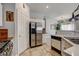 Bright kitchen with stainless steel refrigerator and sleek countertops at 3313 Jamaica Princess Pl # 3, North Las Vegas, NV 89084