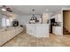 Spacious living room with island seating adjacent to the kitchen, ideal for entertaining at 3313 Jamaica Princess Pl # 3, North Las Vegas, NV 89084