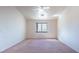 Spacious bedroom featuring a ceiling fan and a window with natural light at 3360 S Rainbow Ave, Pahrump, NV 89048