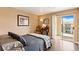 Bedroom with hardwood floors, a sliding door to a balcony and neutral walls at 3550 Bay Sands Dr # 3020, Laughlin, NV 89029