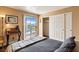 Cozy bedroom with sliding glass door to a balcony and view of mountains at 3550 Bay Sands Dr # 3020, Laughlin, NV 89029