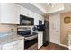 Bright and modern kitchen with stainless steel appliances, white cabinets, and granite countertops at 3550 Bay Sands Dr # 3020, Laughlin, NV 89029
