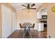 Dining area features hard wood floors, industrial table and chairs and white cabinets at 3550 Bay Sands Dr # 3020, Laughlin, NV 89029