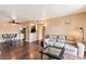 Open-concept living room with hard wood floors, neutral paint, and couch and dining area at 3550 Bay Sands Dr # 3020, Laughlin, NV 89029