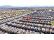 Sweeping aerial view captures a neighborhood with many homes, streets, and green spaces at 3807 Andorian Ave, North Las Vegas, NV 89084