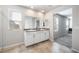 Bathroom featuring double sinks, granite countertops, and tiled flooring at 3807 Andorian Ave, North Las Vegas, NV 89084