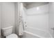 Clean bathroom featuring a bright white tiled shower and modern fixtures at 3807 Andorian Ave, North Las Vegas, NV 89084