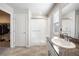 Bright bathroom featuring granite counters, shower, and a large closet for optimal storage at 3807 Andorian Ave, North Las Vegas, NV 89084