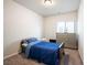 This bedroom features neutral walls, carpet, and a large window at 3807 Andorian Ave, North Las Vegas, NV 89084