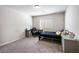 This bedroom features neutral walls, carpet, and a large window at 3807 Andorian Ave, North Las Vegas, NV 89084