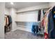 Large walk-in closet with ample storage, shelving and modern carpet at 3807 Andorian Ave, North Las Vegas, NV 89084