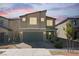 Beautiful home with a two-car garage, manicured landscaping, and inviting curb appeal at 3807 Andorian Ave, North Las Vegas, NV 89084