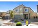 Two-story home with a two car garage and simple front yard landscaping at 3807 Andorian Ave, North Las Vegas, NV 89084