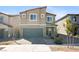 Inviting two-story home featuring a two-car garage and low-maintenance landscaping at 3807 Andorian Ave, North Las Vegas, NV 89084