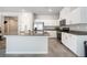 Modern kitchen with granite countertops, white cabinets and stainless steel appliances at 3807 Andorian Ave, North Las Vegas, NV 89084