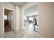 Welcoming entryway view showcases the open living space with kitchen, dining area, and backyard access at 3807 Andorian Ave, North Las Vegas, NV 89084