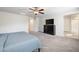 Serene main bedroom boasts plush carpeting, a large dresser, and an en suite bathroom at 3807 Andorian Ave, North Las Vegas, NV 89084