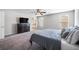 Relaxing main bedroom features plush carpeting, large dresser, and easy access to the ensuite bathroom at 3807 Andorian Ave, North Las Vegas, NV 89084