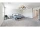 Calm main bedroom features plush carpeting, neutral paint, and ample natural light from the windows at 3807 Andorian Ave, North Las Vegas, NV 89084