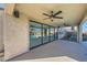 Back porch features a view of pool with large glass doors and ceiling fans at 3892 Pasilla Ave, Las Vegas, NV 89118