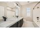A modern bathroom featuring double sinks and stylish fixtures at 3892 Pasilla Ave, Las Vegas, NV 89118