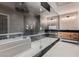 Contemporary bathroom showcasing a glass-enclosed shower, soaking tub, and stylish vanity at 3892 Pasilla Ave, Las Vegas, NV 89118
