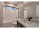 Bright bathroom featuring tiled shower-tub, modern vanity and fixtures, and great lighting at 3892 Pasilla Ave, Las Vegas, NV 89118