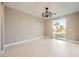 Bright bedroom with sliding glass doors that reveal a nice yard with palm trees at 3892 Pasilla Ave, Las Vegas, NV 89118