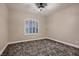 Neutral bedroom with arched window and neutral carpet at 3892 Pasilla Ave, Las Vegas, NV 89118