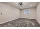 Bedroom features neutral colored walls and modern ceiling fan above textured carpet flooring at 3892 Pasilla Ave, Las Vegas, NV 89118