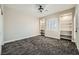 Neutral bedroom featuring plush patterned carpet, shuttered window and built in shelving at 3892 Pasilla Ave, Las Vegas, NV 89118