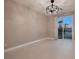 Bright bedroom with sliding glass doors that reveal a nice yard with palm trees at 3892 Pasilla Ave, Las Vegas, NV 89118