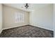 Well-lit bedroom features contemporary ceiling fan and elegant plantation shutters at 3892 Pasilla Ave, Las Vegas, NV 89118