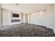 Large bedroom featuring plush carpets, a media center with fireplace, and recessed lights at 3892 Pasilla Ave, Las Vegas, NV 89118