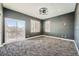 A stylish bedroom with sliding door and large windows at 3892 Pasilla Ave, Las Vegas, NV 89118