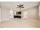 Bonus room featuring whitewashed floors, wet bar with dark cabinetry and great natural light at 3892 Pasilla Ave, Las Vegas, NV 89118