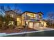 Beautiful two-story home with stone accents, arched entrance, balcony, and well-kept landscaping at 3892 Pasilla Ave, Las Vegas, NV 89118