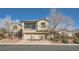 Lovely two-story home with a brick driveway, three-car garage and attractive desert landscaping at 3892 Pasilla Ave, Las Vegas, NV 89118