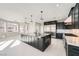 Modern kitchen featuring a large island with bar seating and stainless steel appliances at 3892 Pasilla Ave, Las Vegas, NV 89118