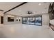 Open living room with views of the pool and waterfall at 3892 Pasilla Ave, Las Vegas, NV 89118