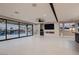 Expansive living area with sliding glass doors and a sleek fireplace, offering seamless indoor-outdoor living at 3892 Pasilla Ave, Las Vegas, NV 89118