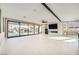Spacious living room featuring modern fireplace and backyard views at 3892 Pasilla Ave, Las Vegas, NV 89118