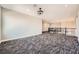 Spacious loft area with plush patterned carpets and wrought iron railing at 3892 Pasilla Ave, Las Vegas, NV 89118