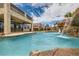 Luxury home's pool area features a rock waterfall, creating a serene outdoor living space at 3892 Pasilla Ave, Las Vegas, NV 89118